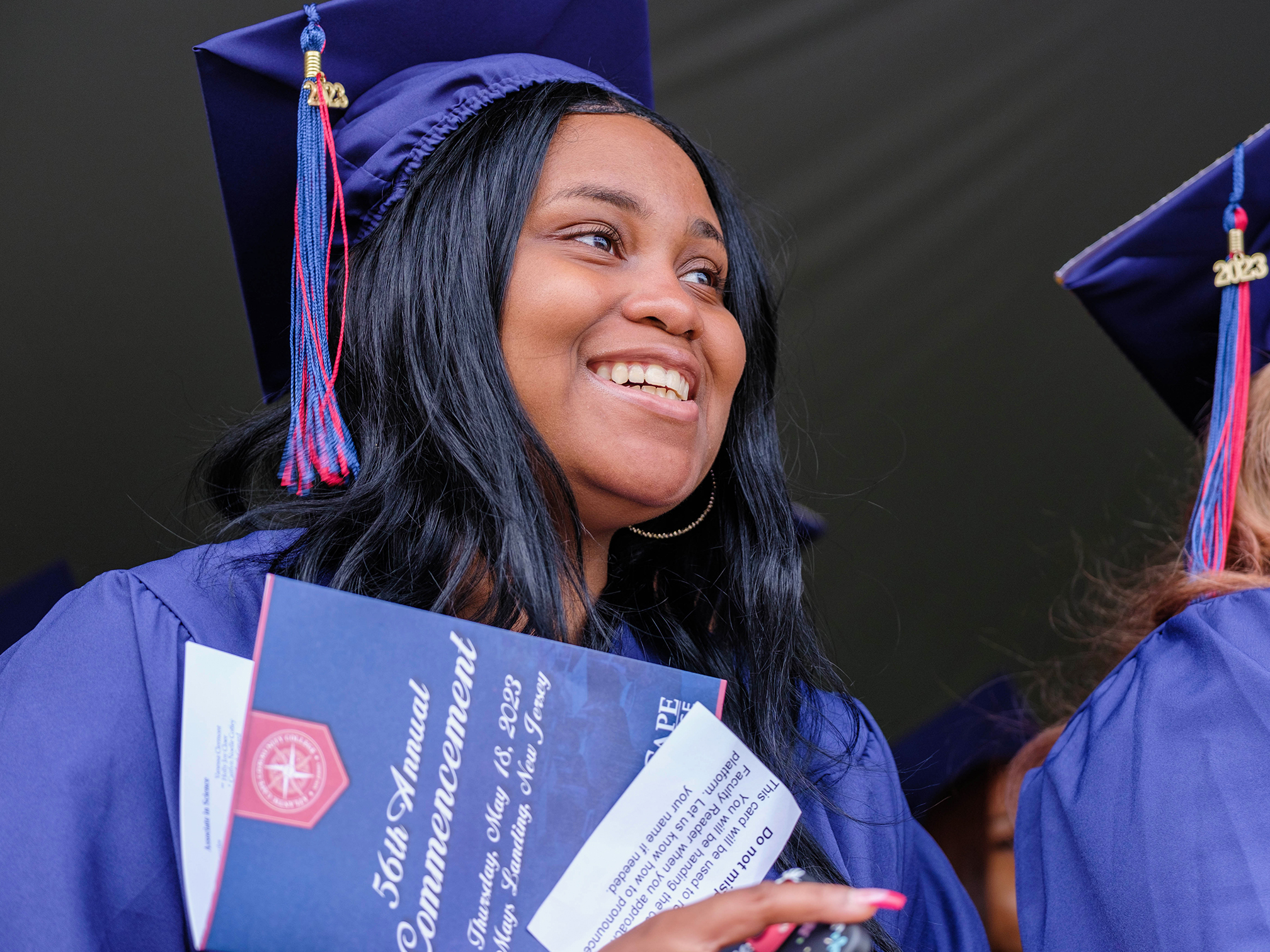 Student smiling at commencement
