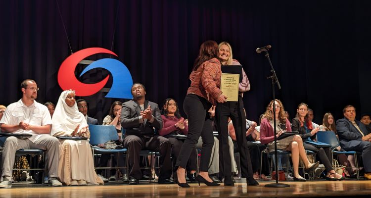 Graduating student recognizes her professor with Extra Miler Award during CSS Graduate Award Ceremony